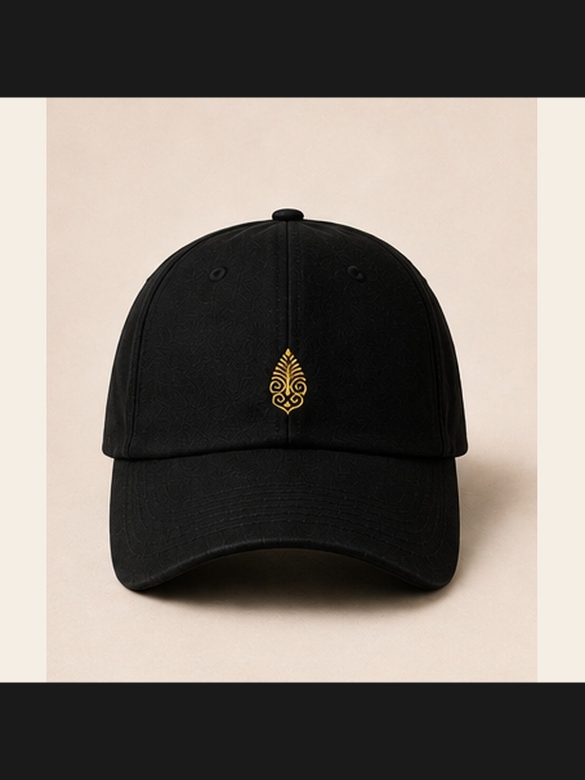 Pyramidion Crest Hat in black with the gold Pyramidion crest centred on the front, photographed without a model.